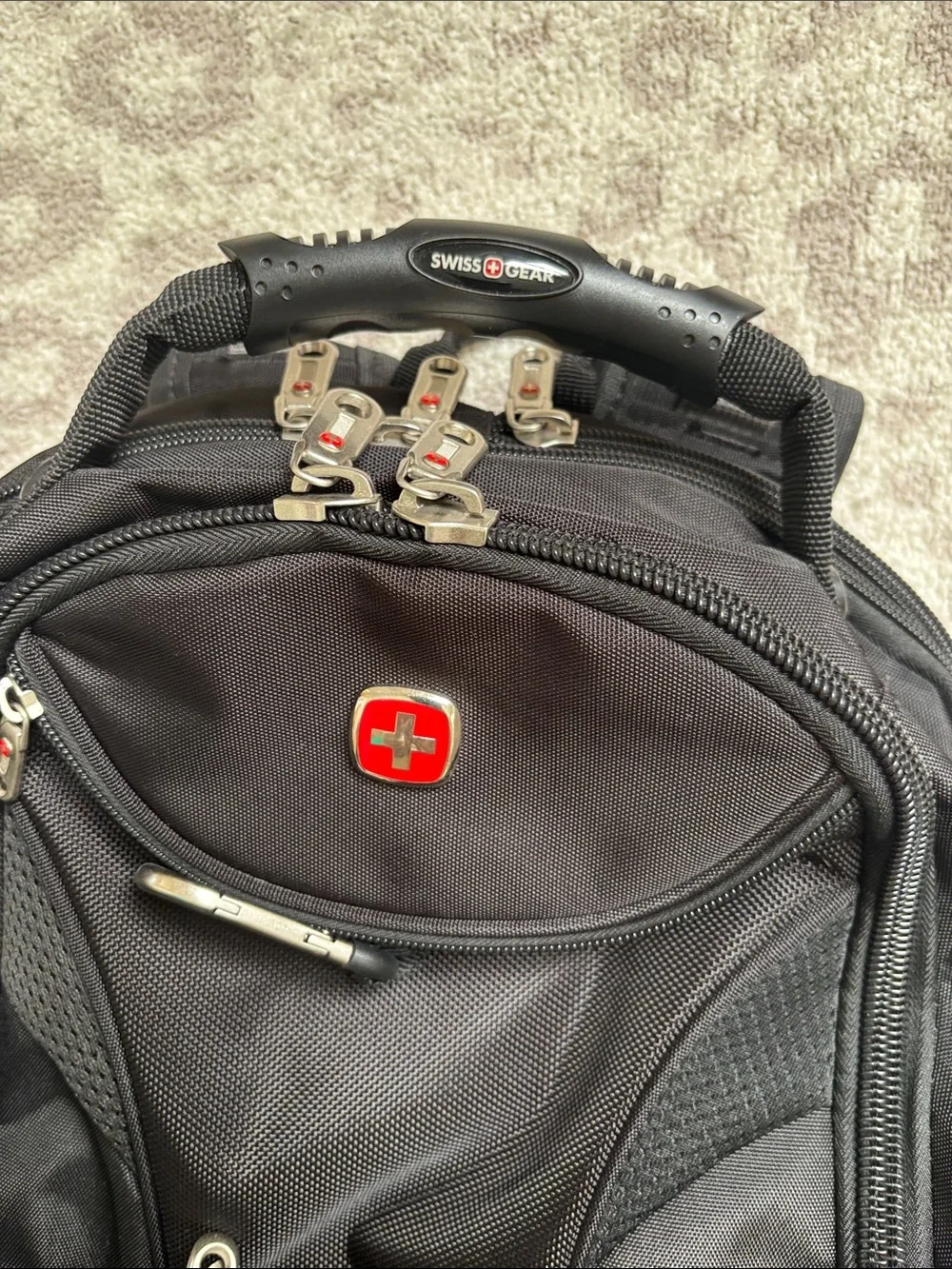 SwissGear Black Travel Backpack with Red Logo Accent